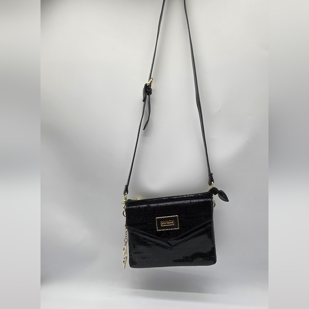 Betsy Johnson Black Patent Logo-Embossed Crossbody with Gold Hardware.